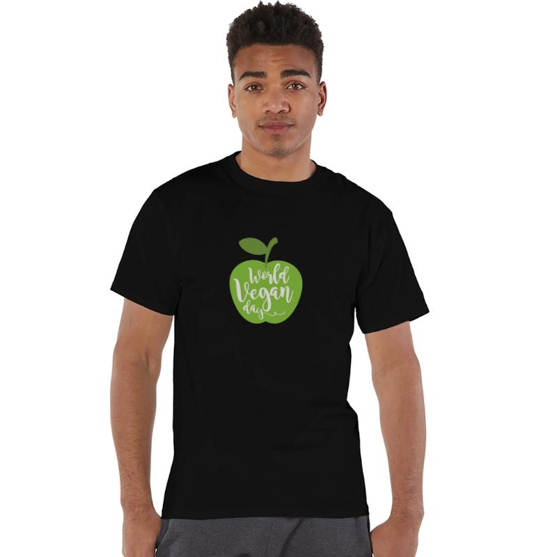 Apple with the inscription world vegan day.